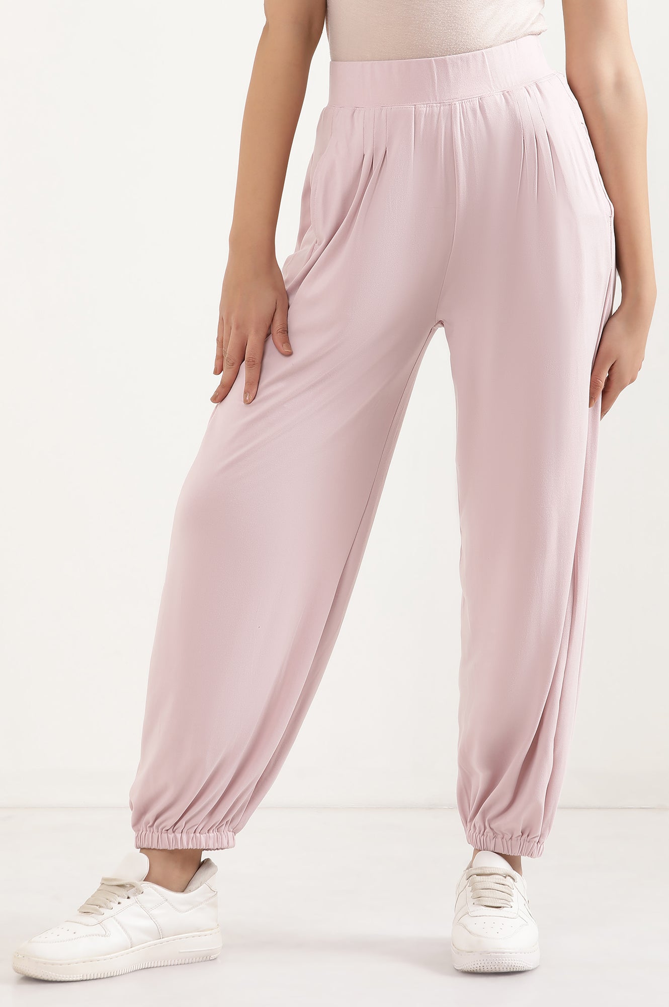 Light Pink Solid Loose Fit Pants With Pleated Detail