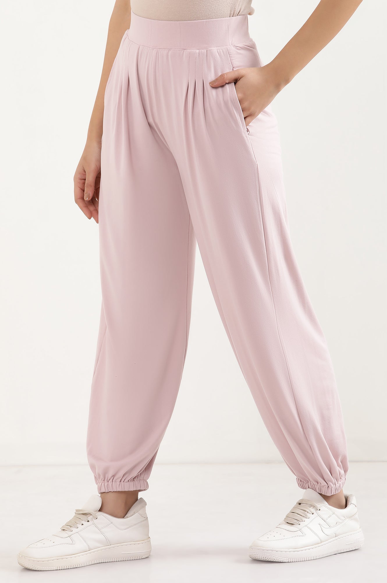 Light Pink Solid Loose Fit Pants With Pleated Detail