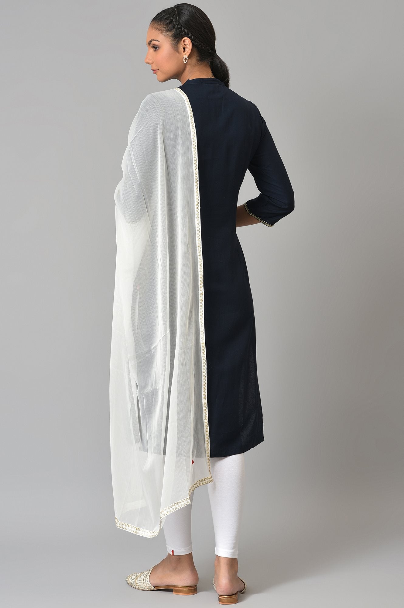 Dark Blue Embroidered kurta With White Tights And Dupatta.