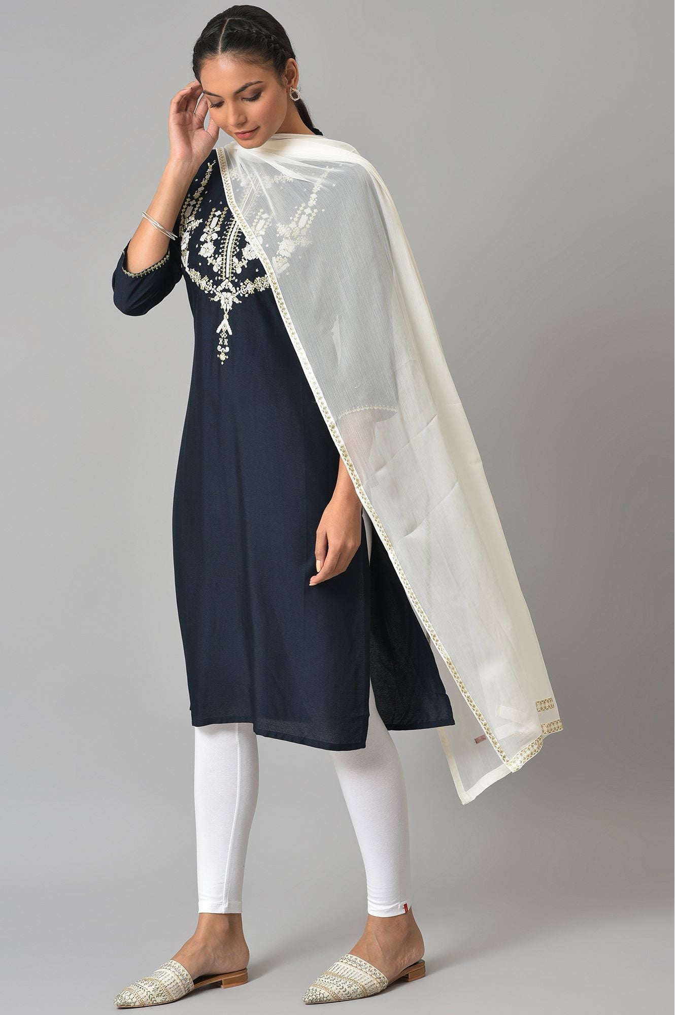 Dark Blue Embroidered kurta With White Tights And Dupatta.