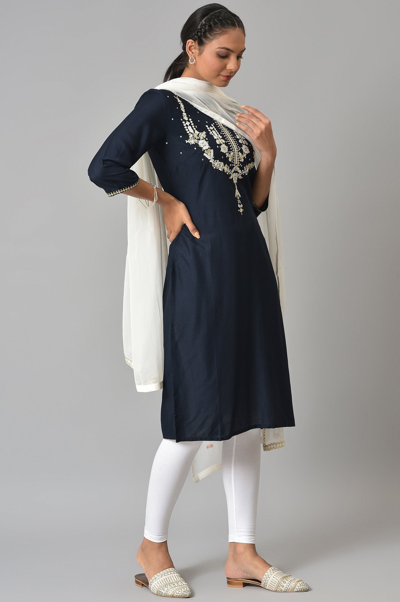 Dark Blue Embroidered kurta With White Tights And Dupatta.