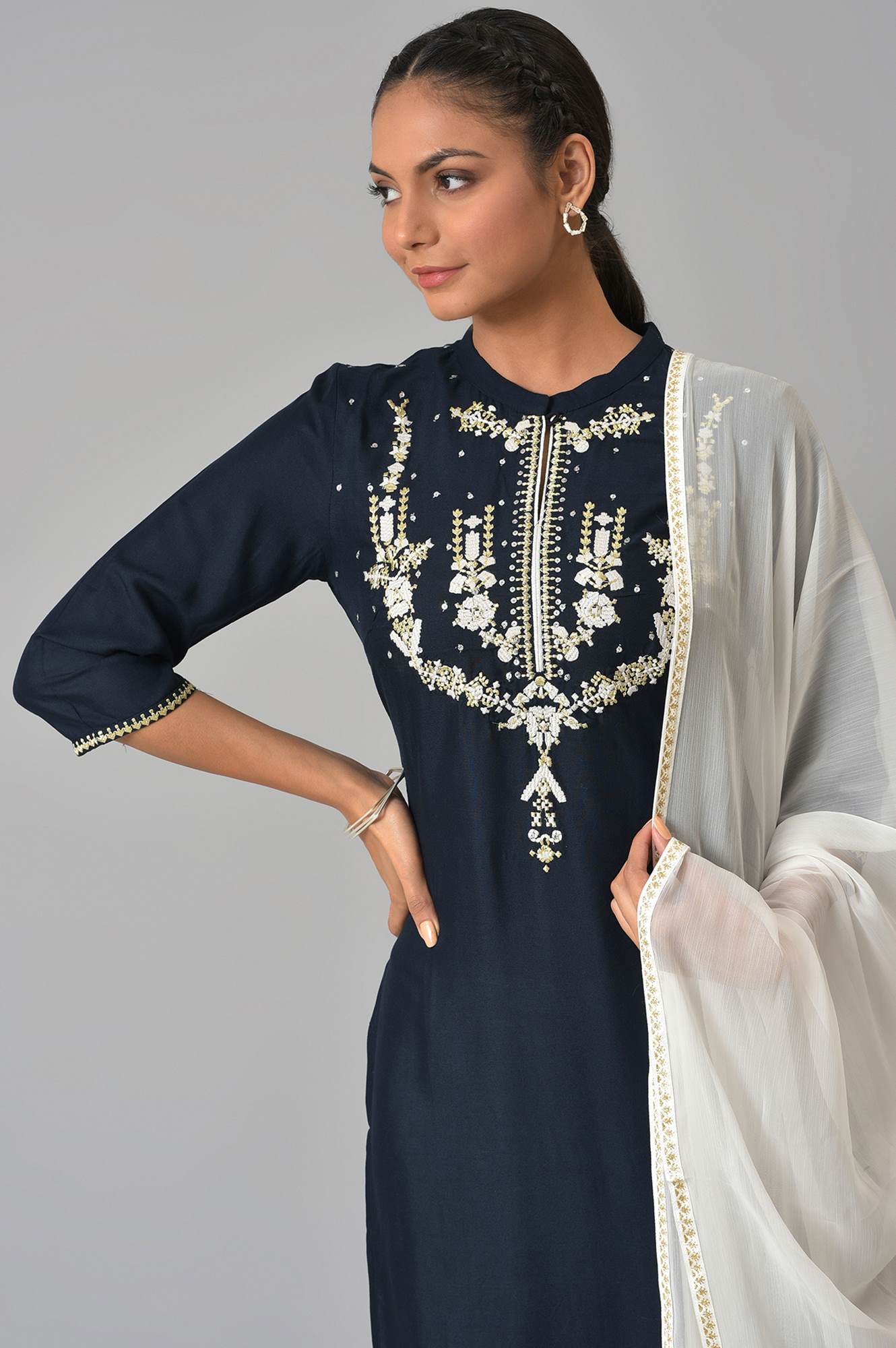 Dark Blue Embroidered kurta With White Tights And Dupatta.