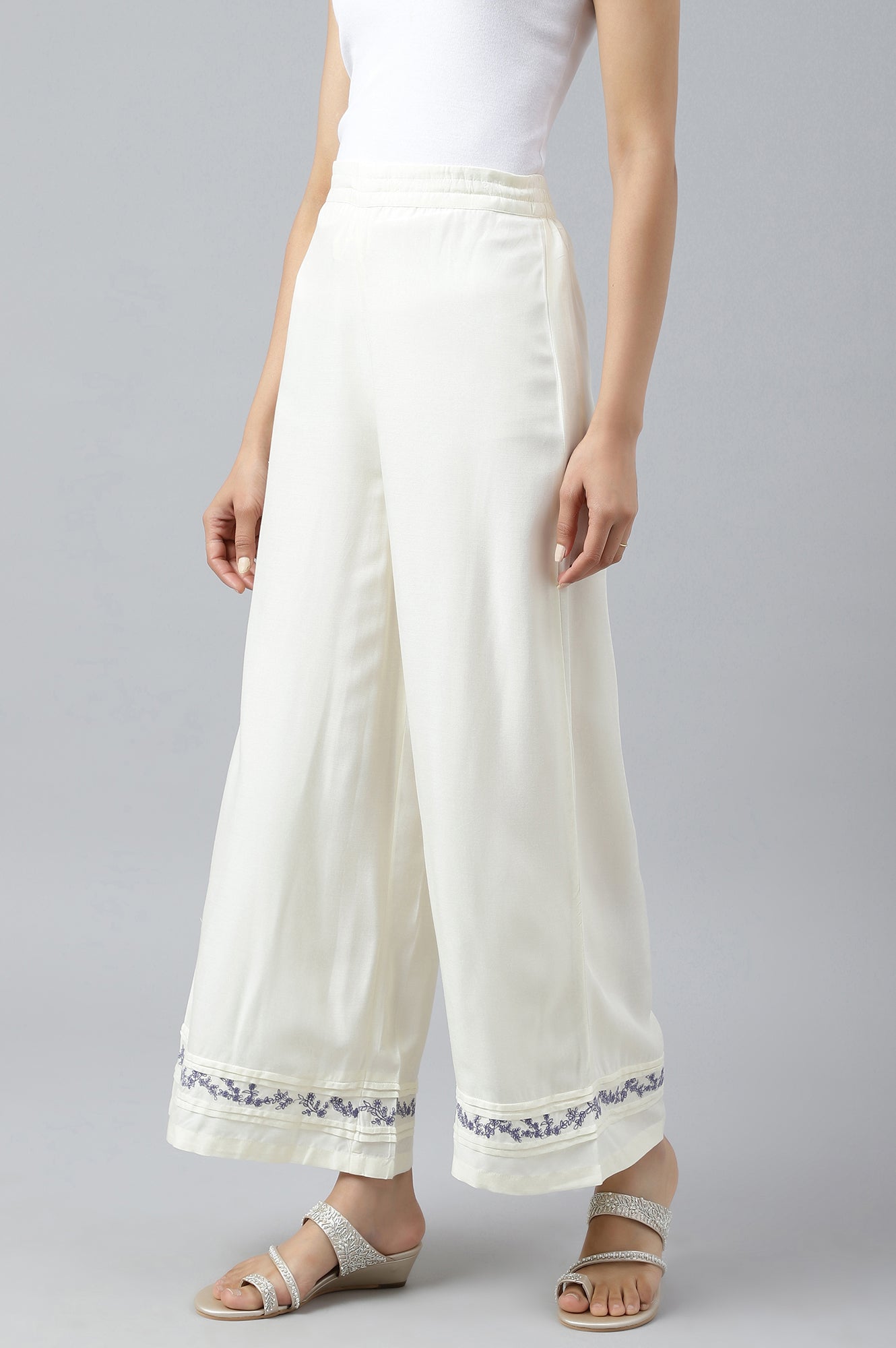 Ecru Embroidered Rayon Parallel Pants With Pleats.