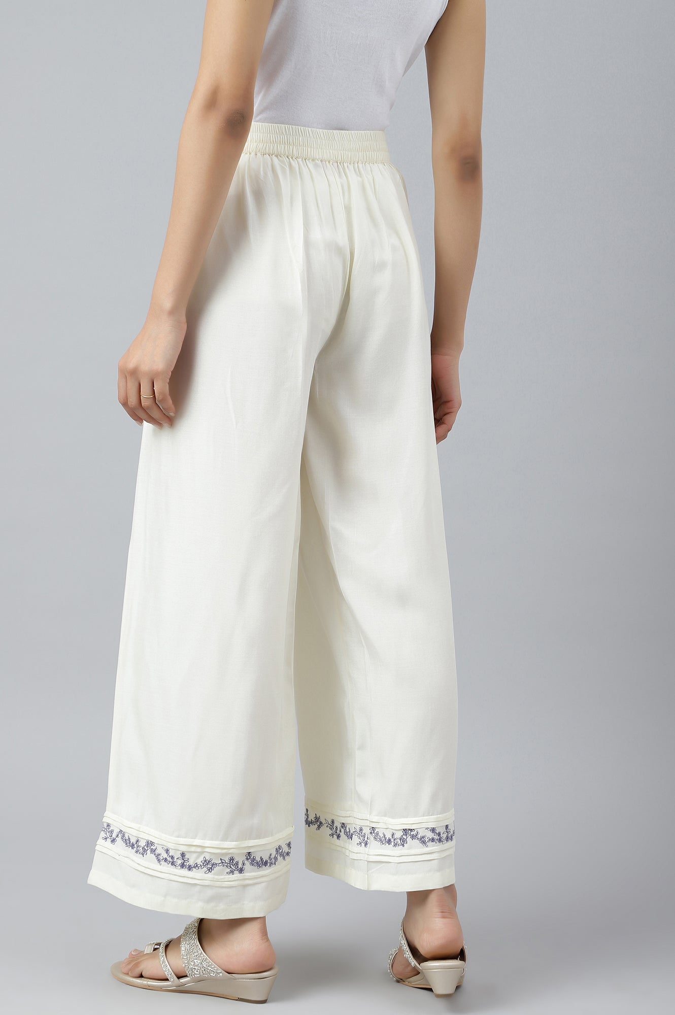 Ecru Embroidered Rayon Parallel Pants With Pleats.