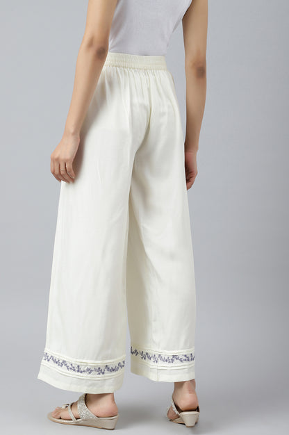 Ecru Embroidered Rayon Parallel Pants With Pleats.