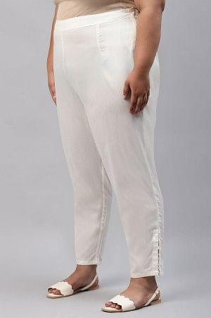 Ecru Solid Light Festive Plus Size Slim Pants - wforwoman