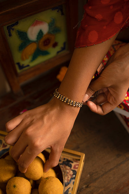 Grey Adjustable Rakhi With Gold Beads