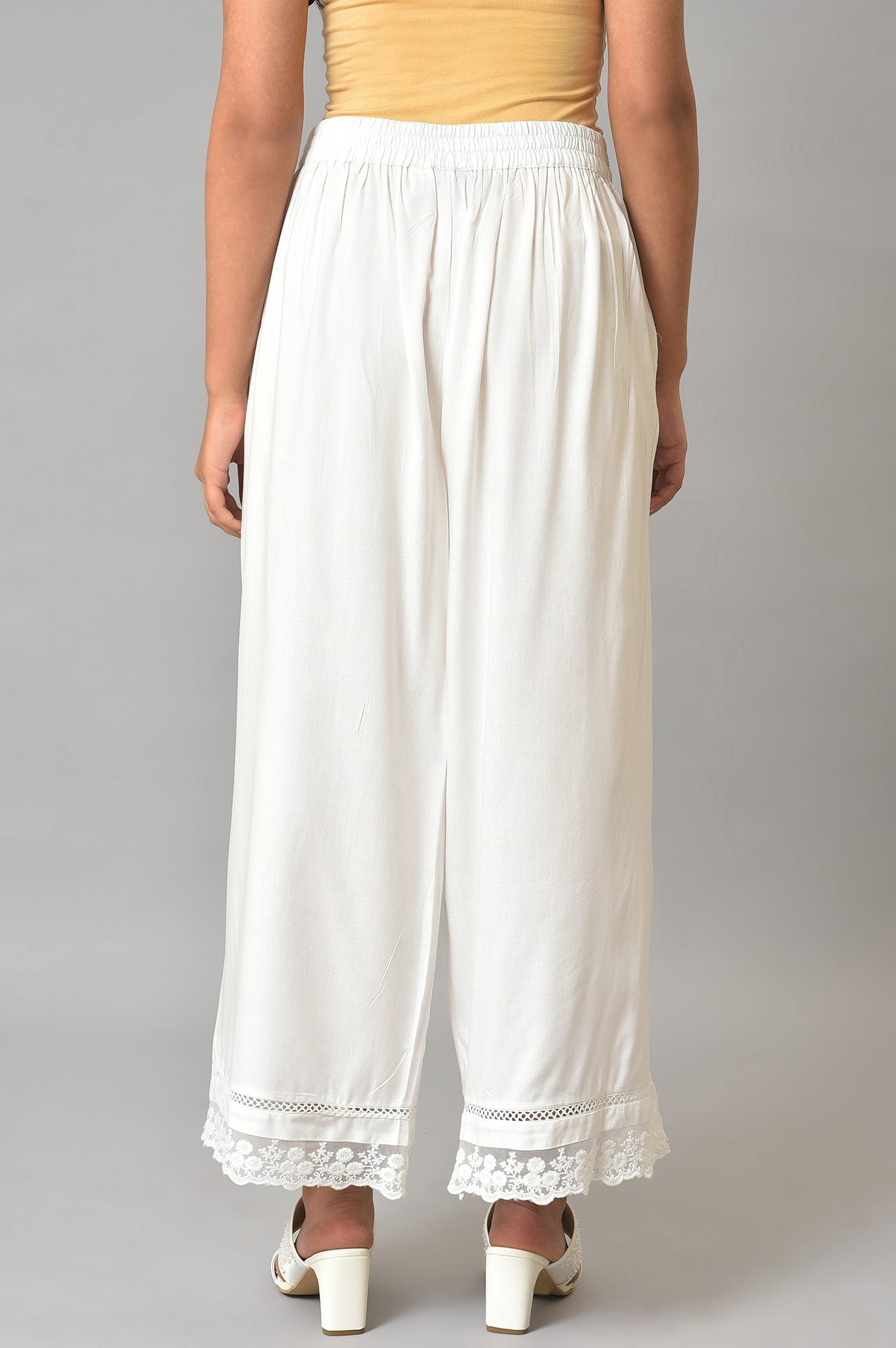 Ecru Parallel Pants With Lace At Hemline