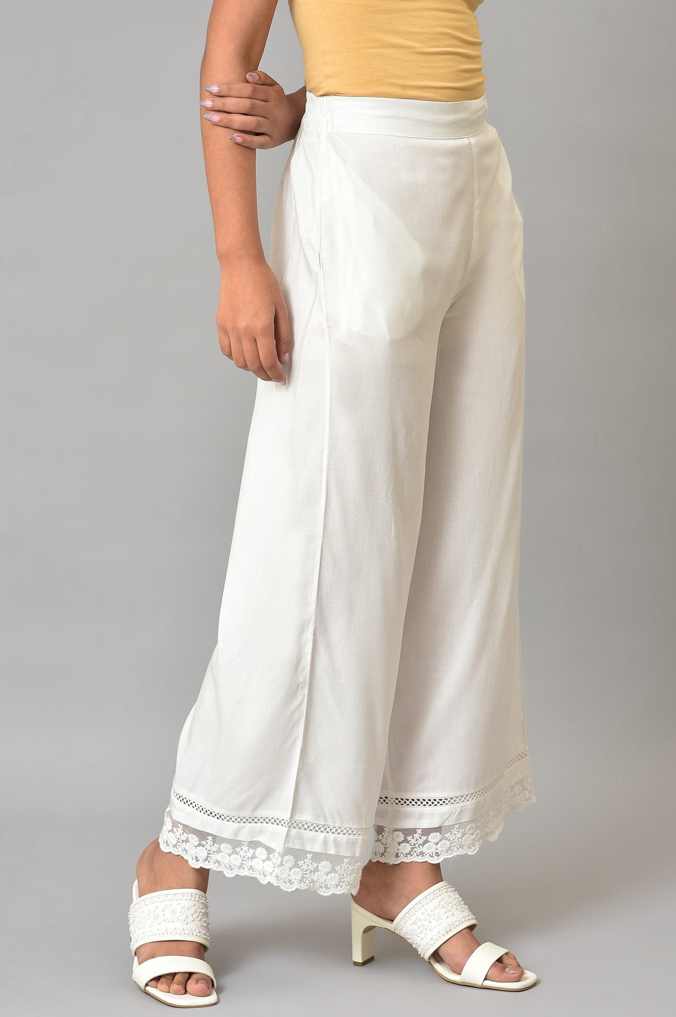 Ecru Parallel Pants With Lace At Hemline