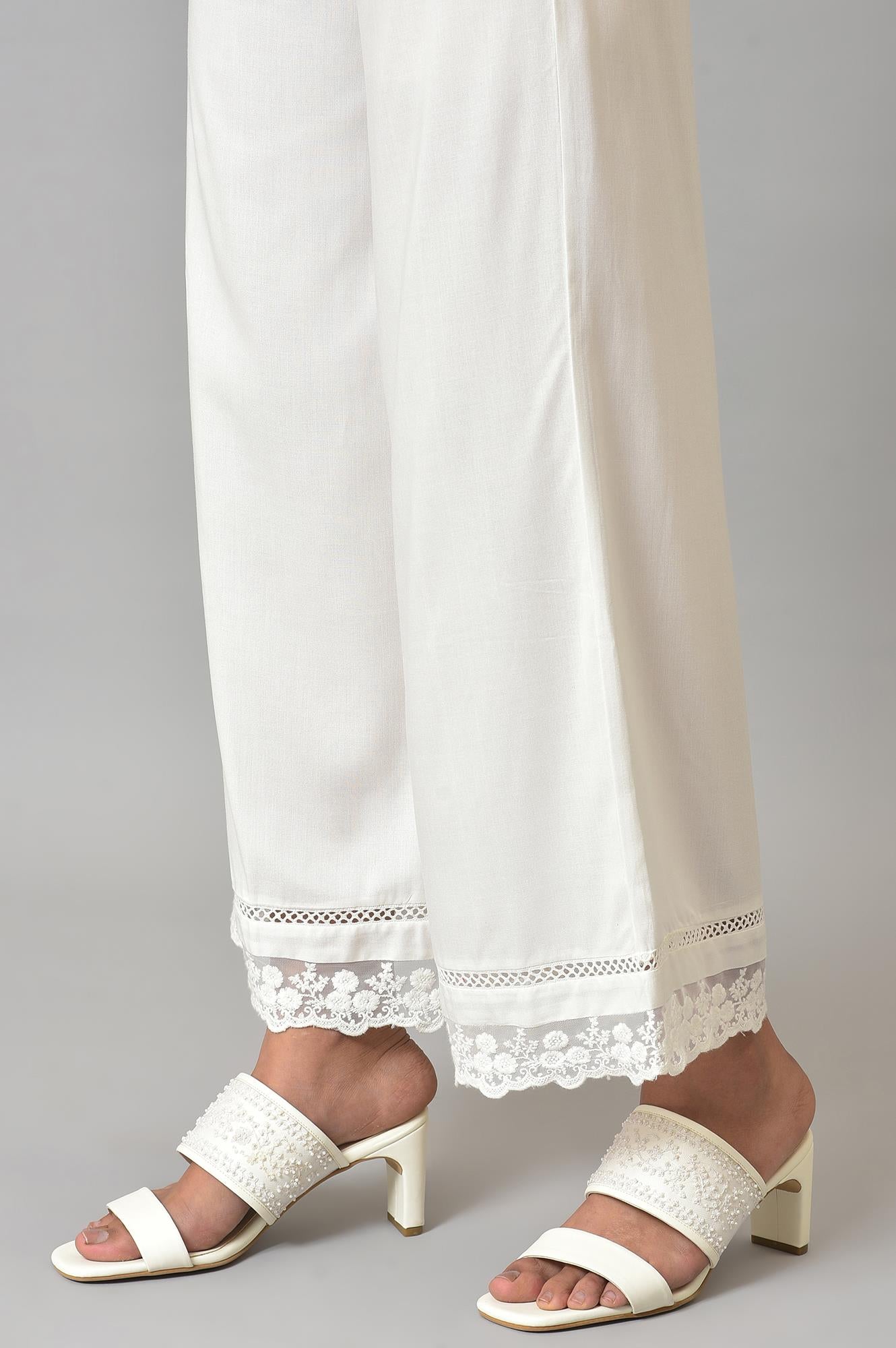 Ecru Parallel Pants With Lace At Hemline