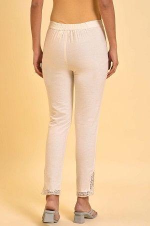 Plus Size Ecru Solid Slim Pants With Lace On Hem - wforwoman