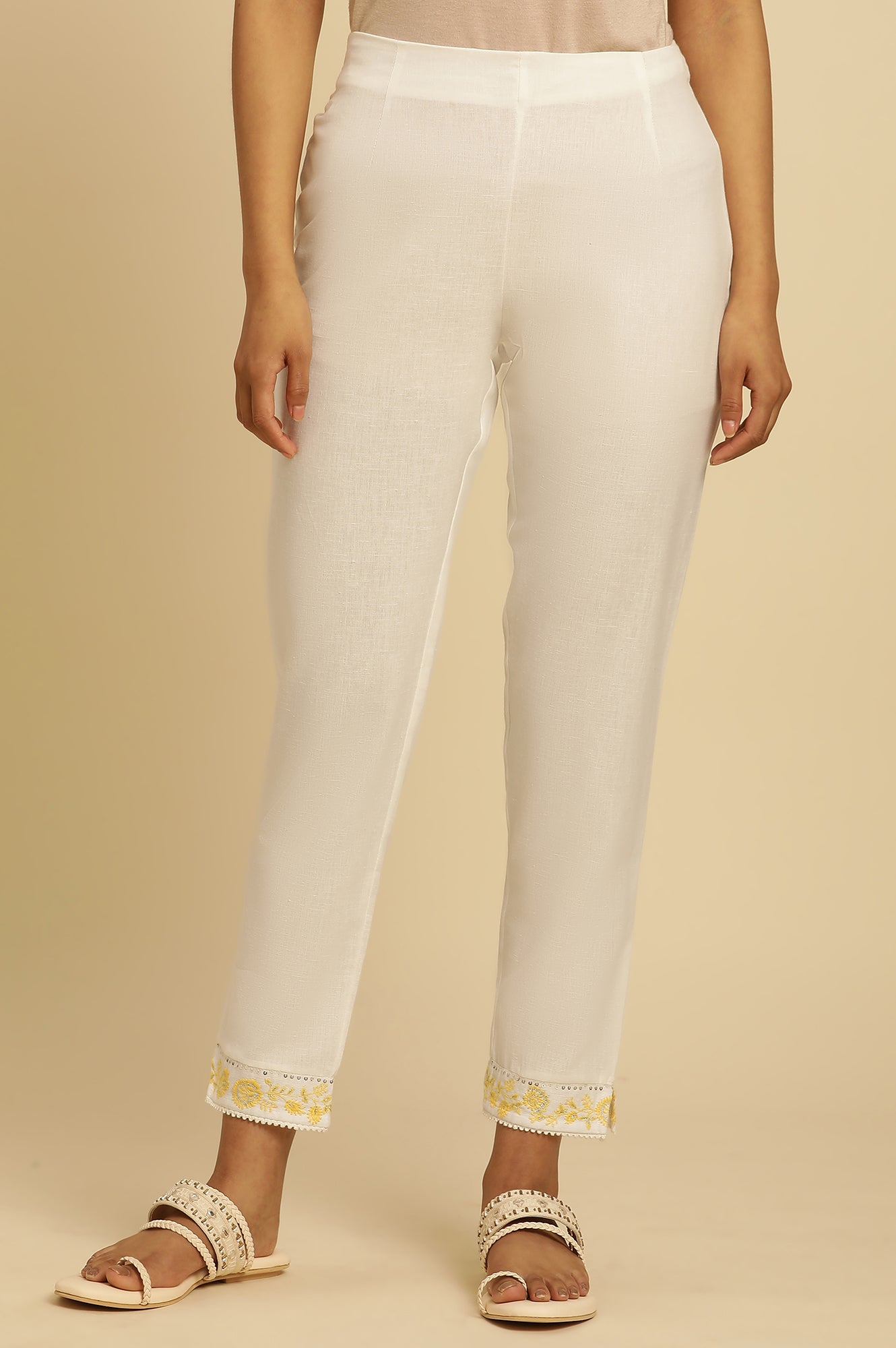 Ecru Solid Straight Pants With Embroidered Hemline