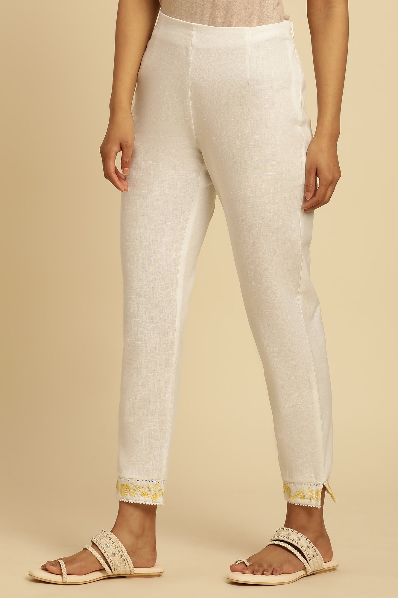 Ecru Solid Straight Pants With Embroidered Hemline