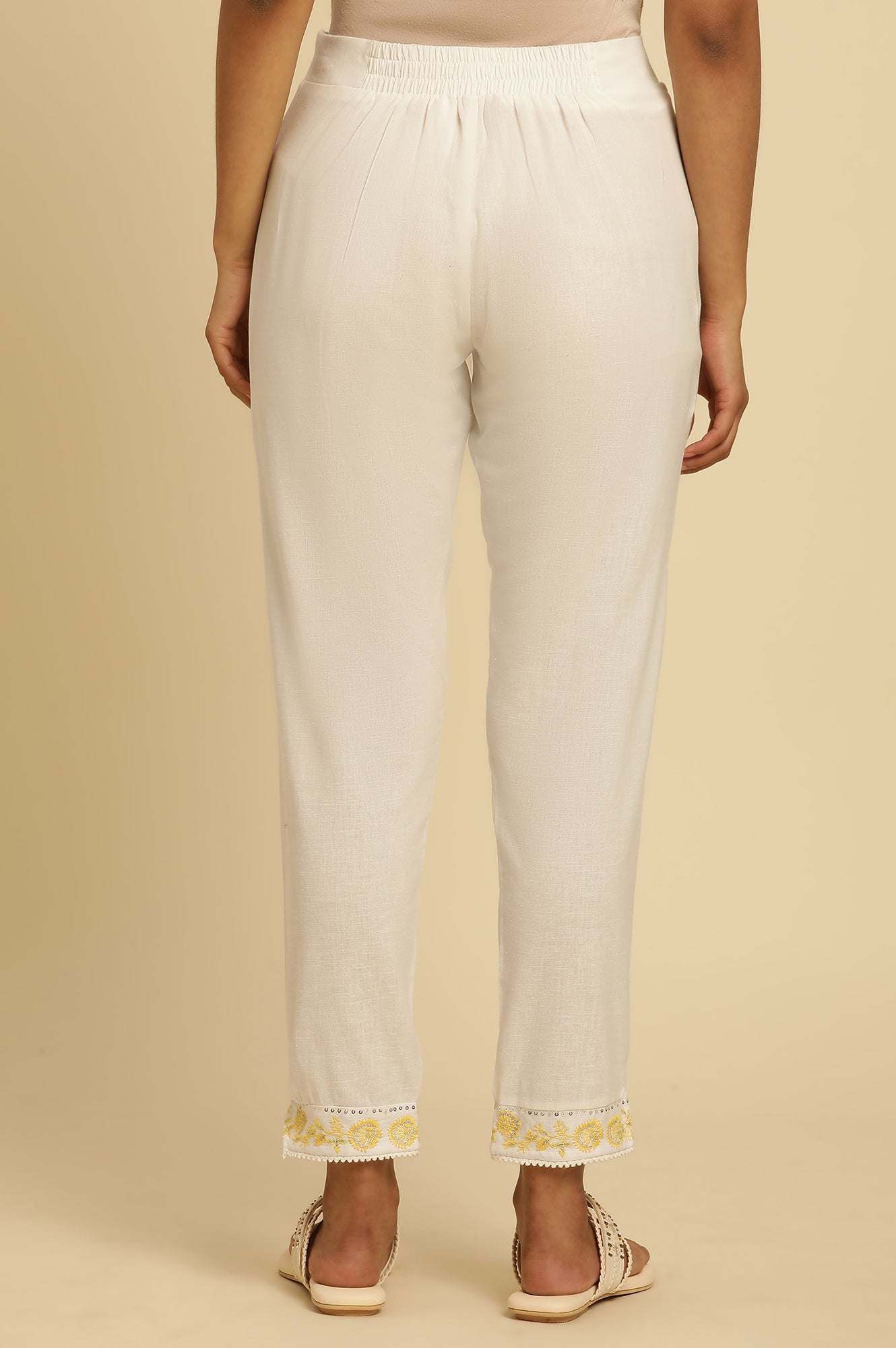 Ecru Solid Straight Pants With Embroidered Hemline