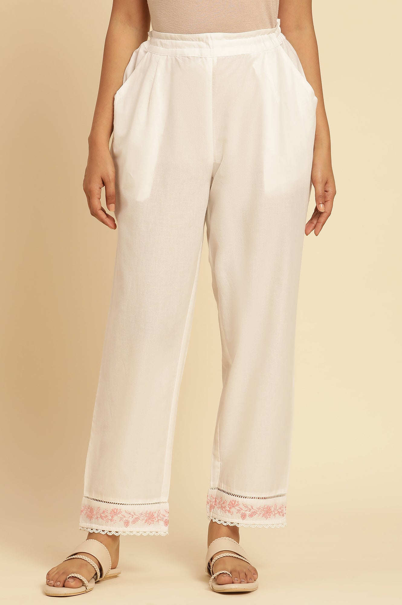 Ecru Solid Straight Pants With Embroidered Hemline