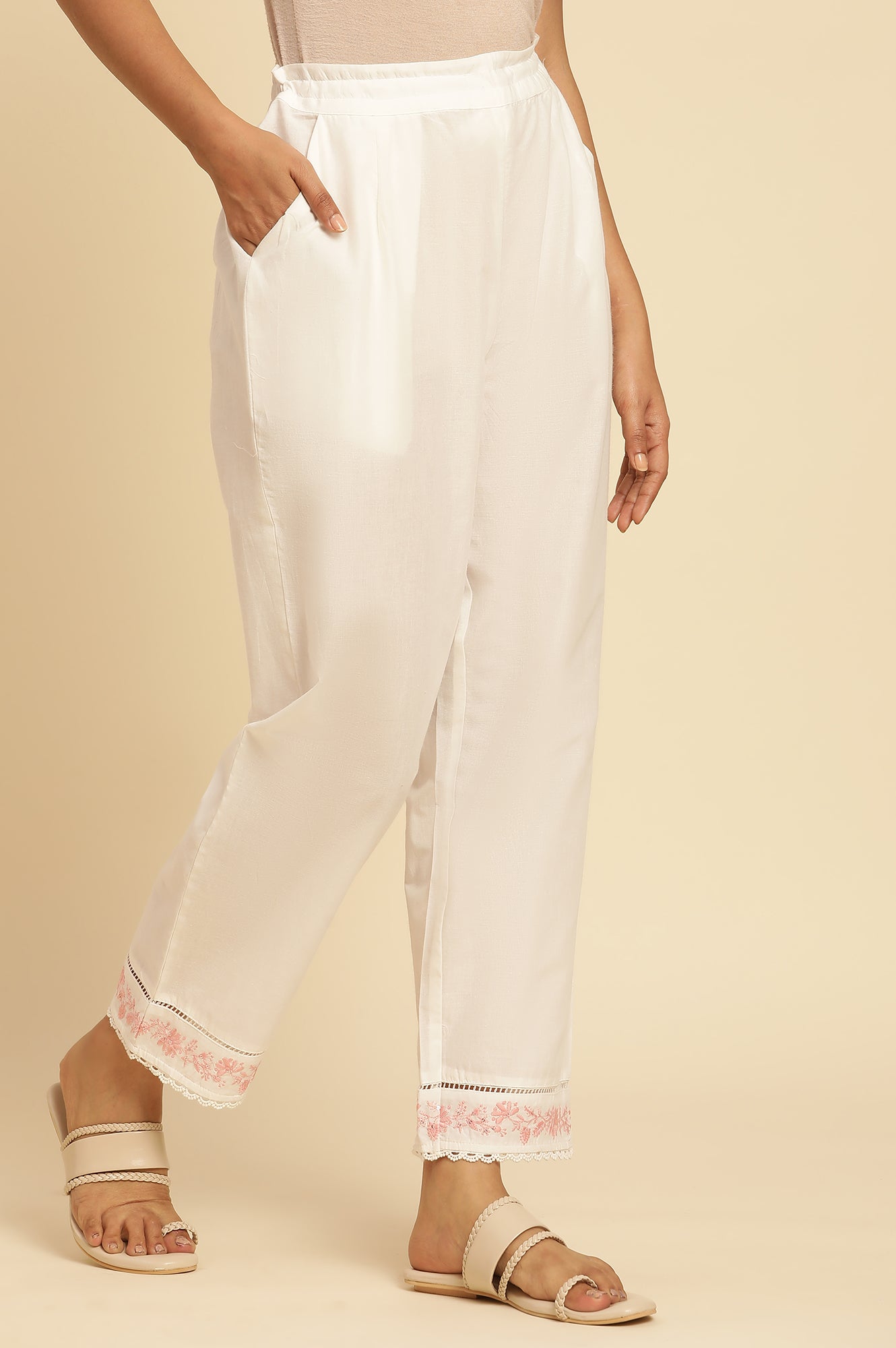 Ecru Solid Straight Pants With Embroidered Hemline