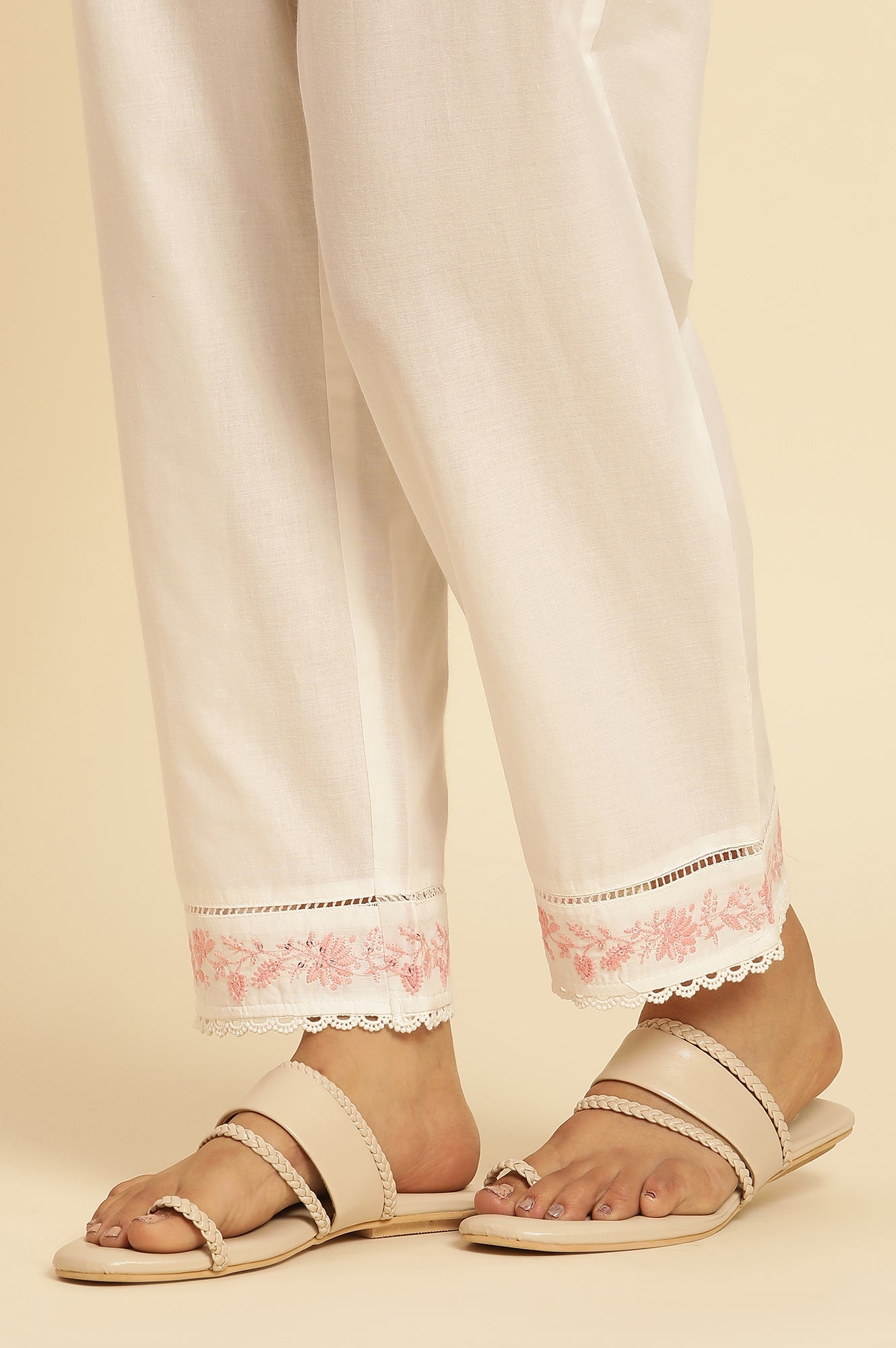 Ecru Solid Straight Pants With Embroidered Hemline