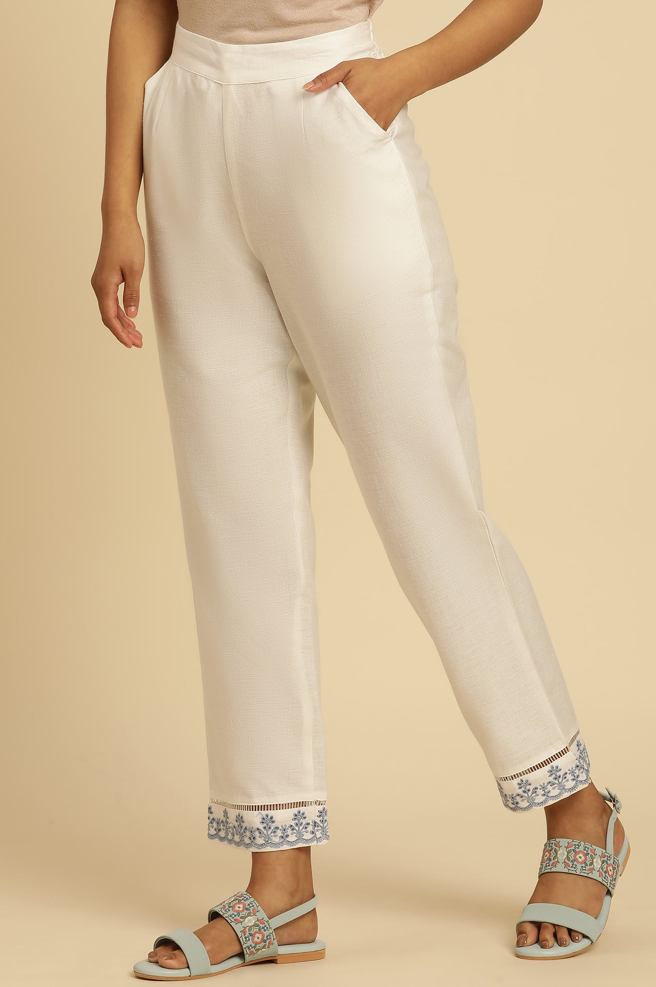 Ecru Solid Straight Pants With Embroidered Hemline