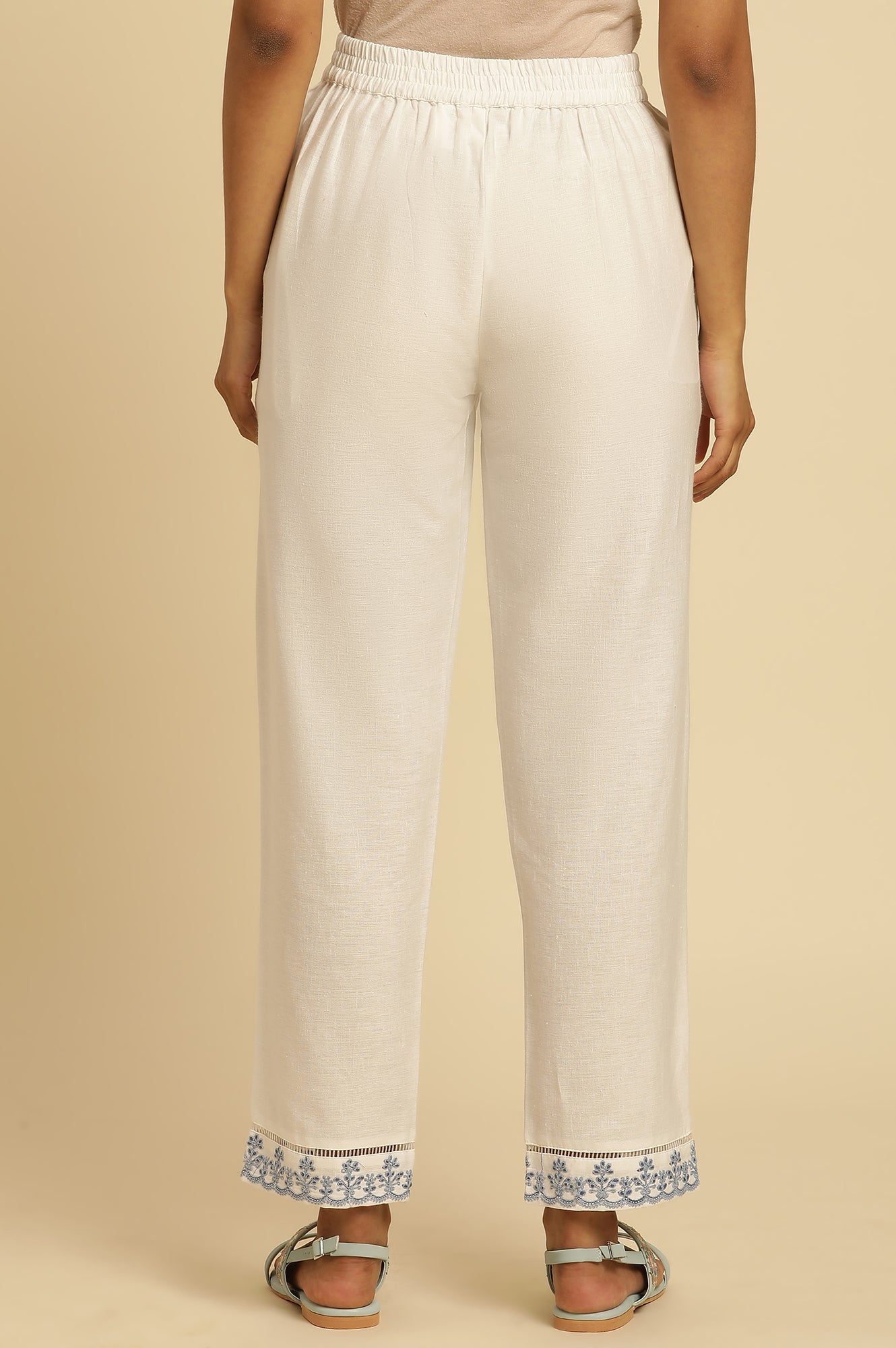 Ecru Solid Straight Pants With Embroidered Hemline