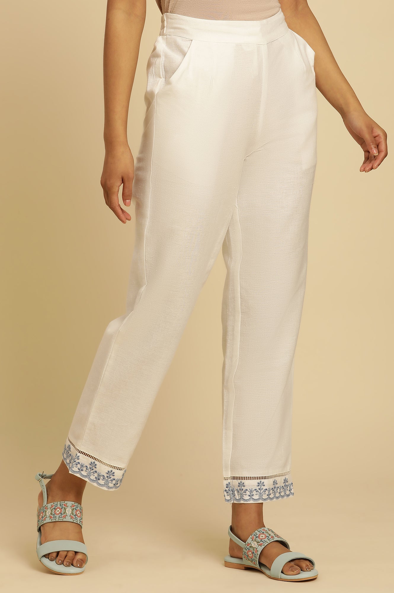 Ecru Solid Straight Pants With Embroidered Hemline