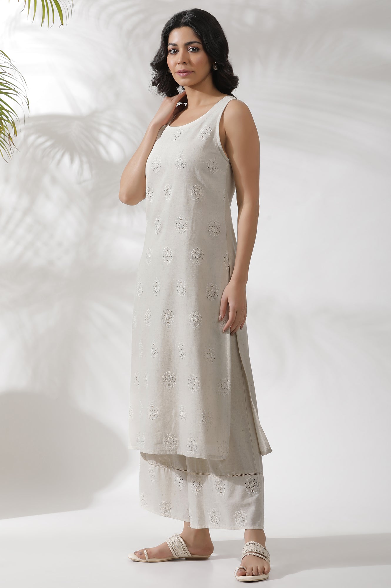 Light Beige Sleeveless Schiffli Kurta And Flared Pants Set