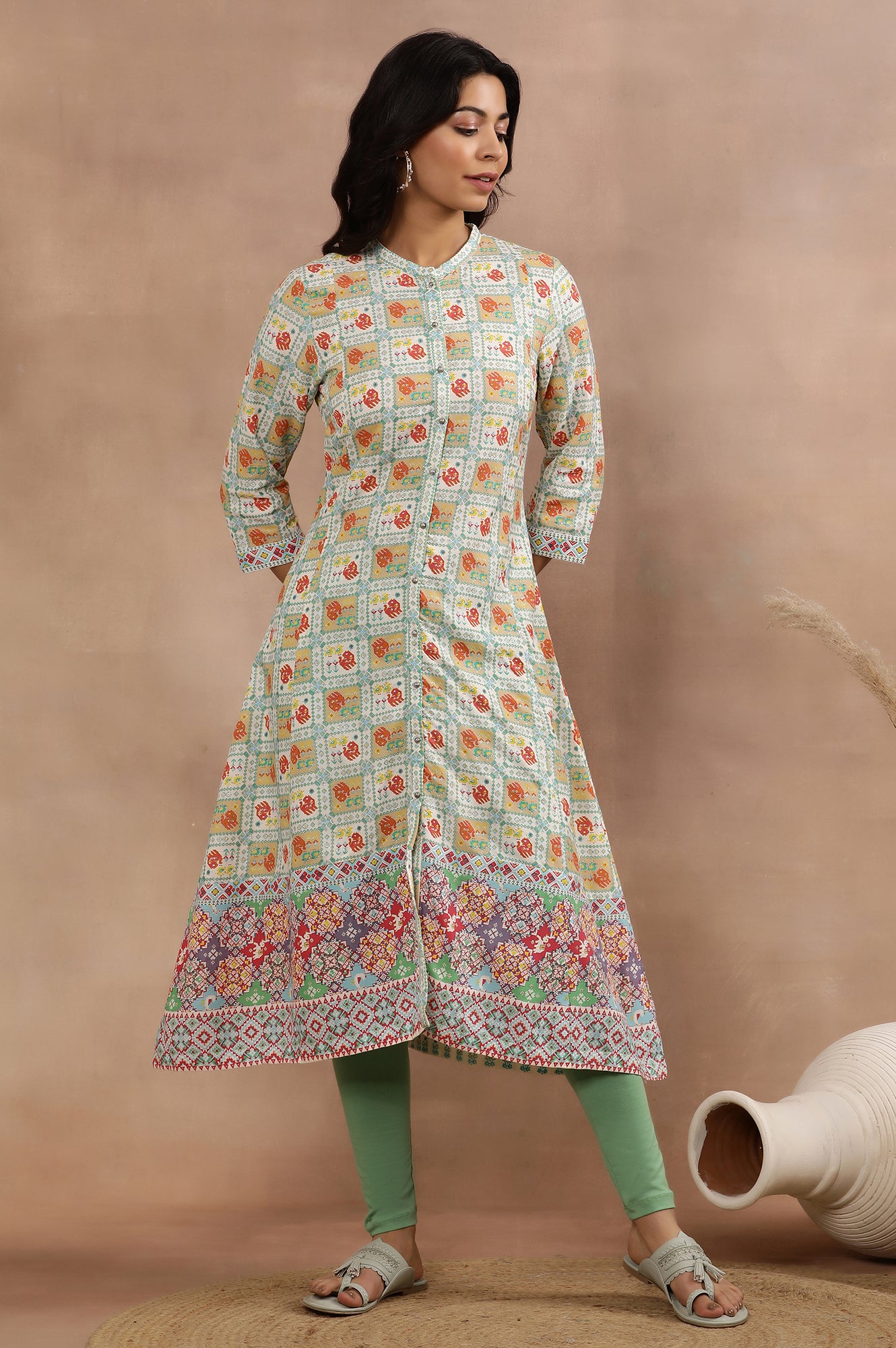 White Flared Kurta With Multi-Coloured Prints And Tights Set