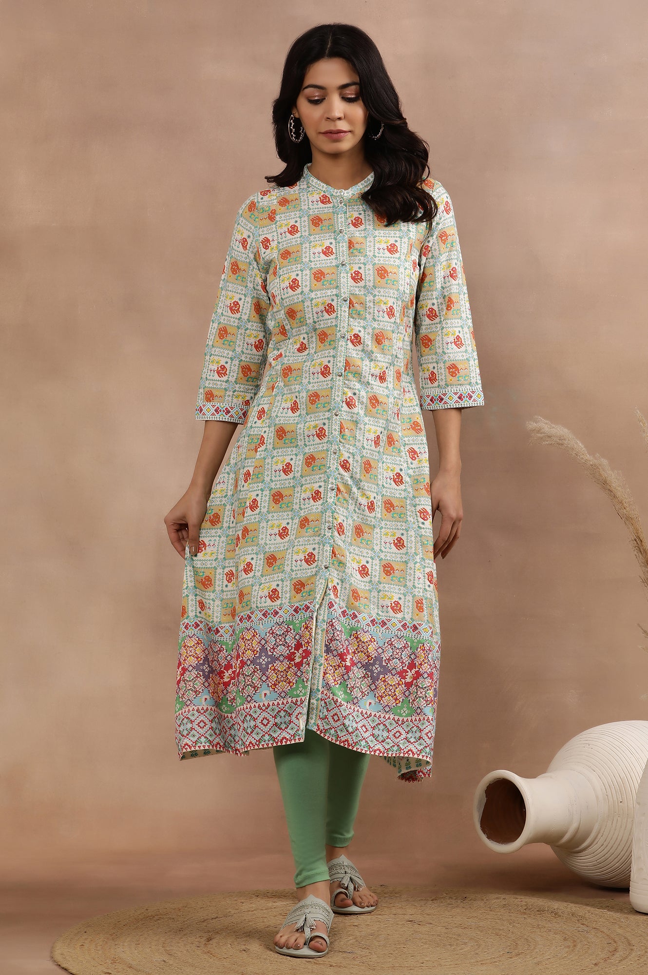 White Flared Kurta With Multi-Coloured Prints And Tights Set