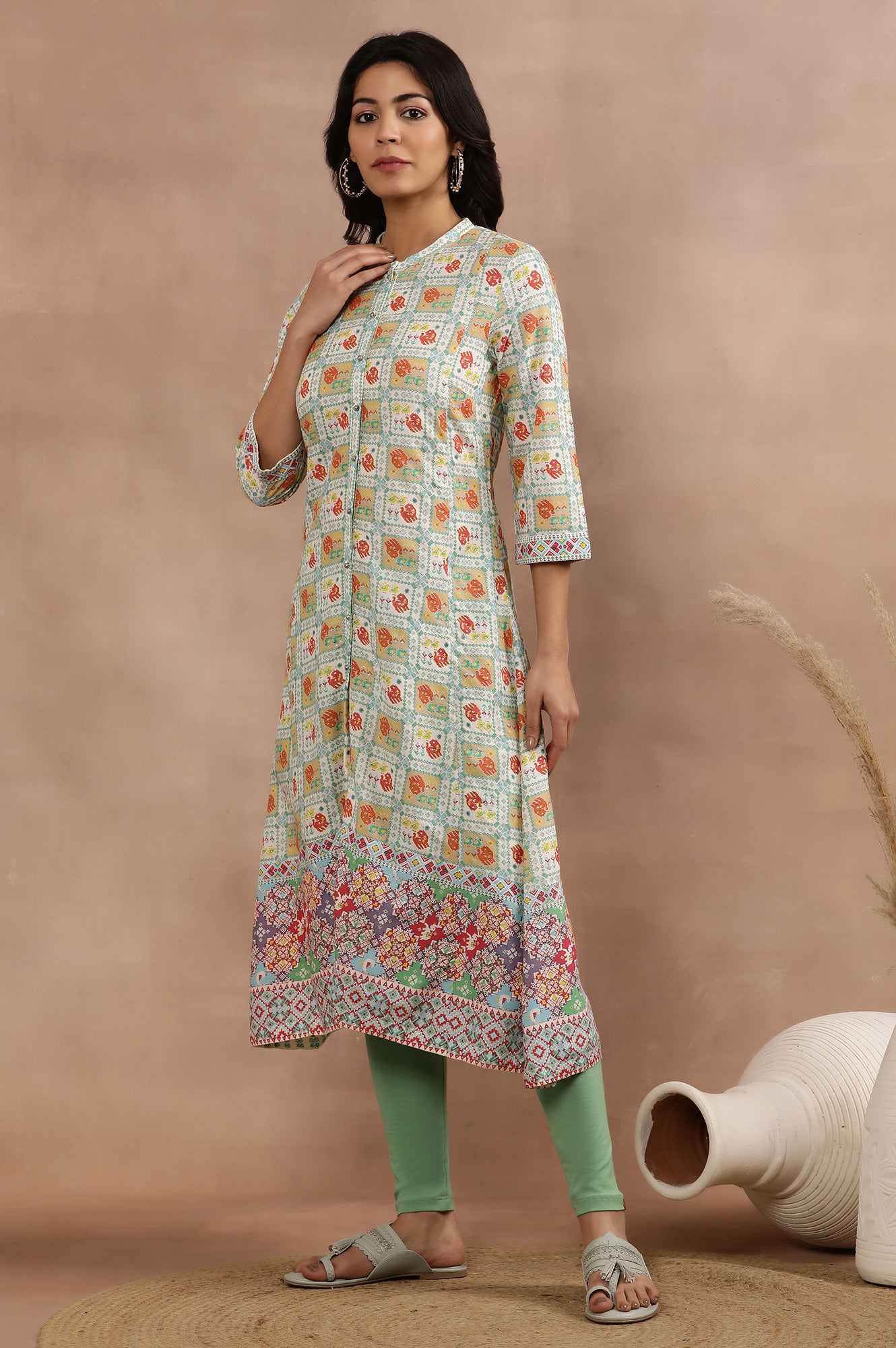 White Flared Kurta With Multi-Coloured Prints And Tights Set