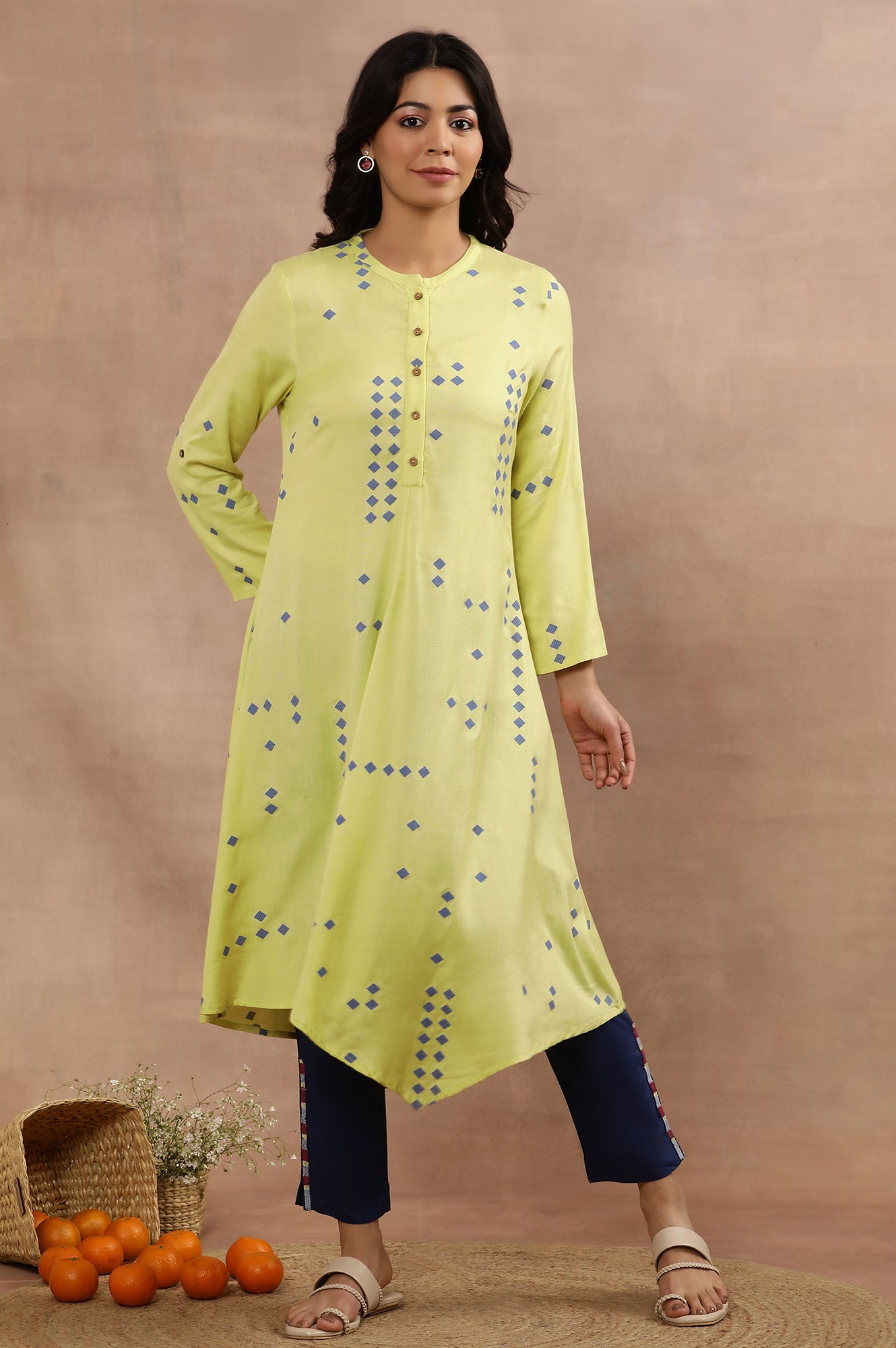 Green Printed Asymmetrical Kurta And Blue Slim Pants Set