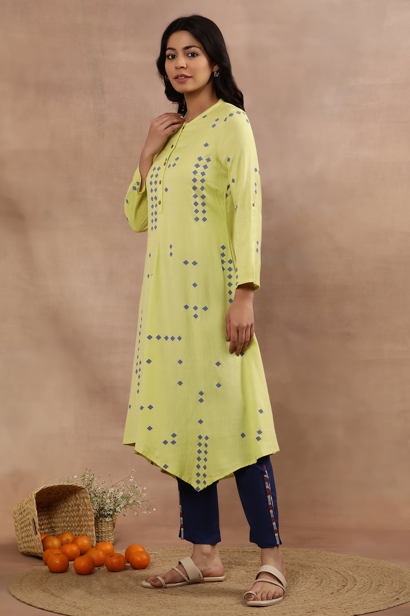 Green Printed Asymmetrical Kurta And Blue Slim Pants Set