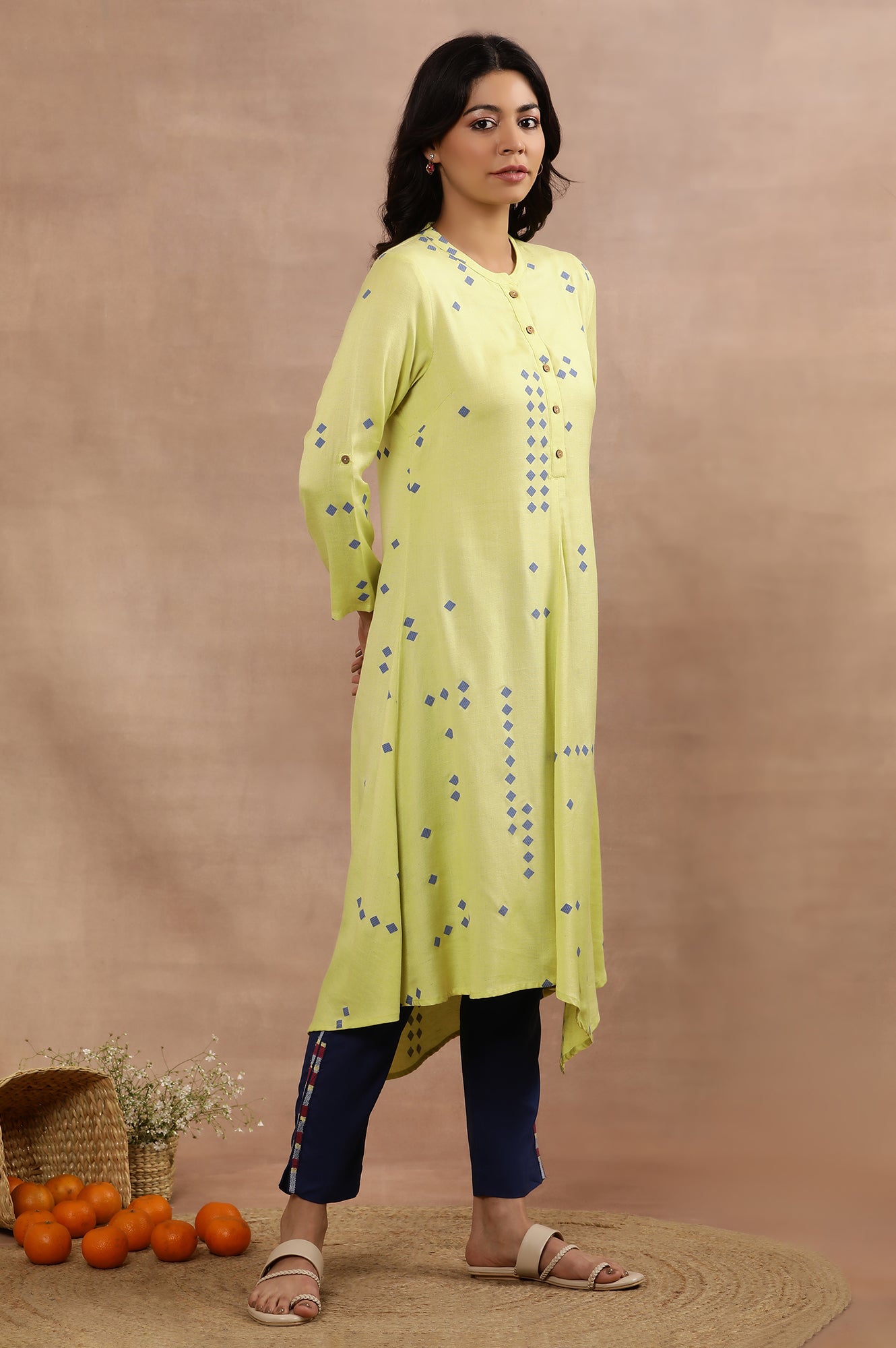 Green Printed Asymmetrical Kurta And Blue Slim Pants Set